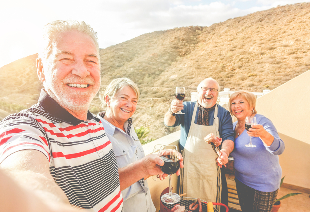 Happy,Senior,Friends,Taking,Selfie,At,Barbecue,Dinner,In,Rented