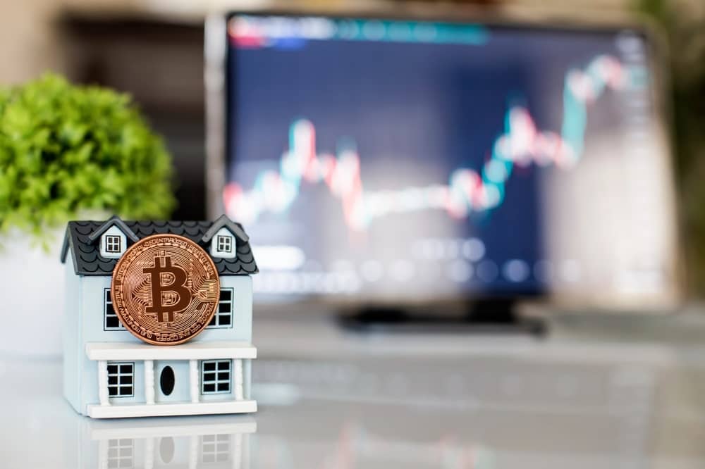 Buying,Real,Estate,Through,Cryptocurrency,,Bitcoin,Coin,On,A,House